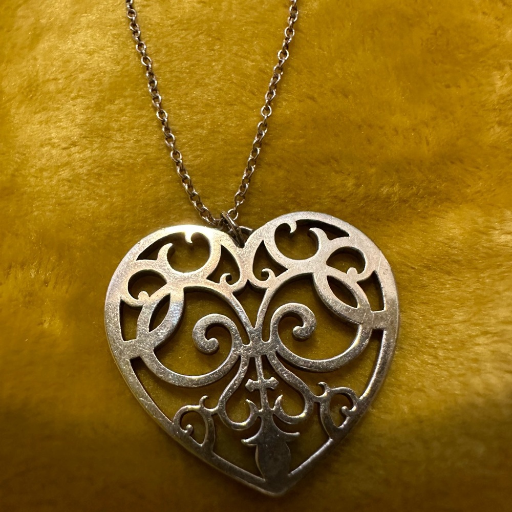 Authentic Tiffany & Co. Sterling Silver Enchant Heart Pendant
18" Necklace